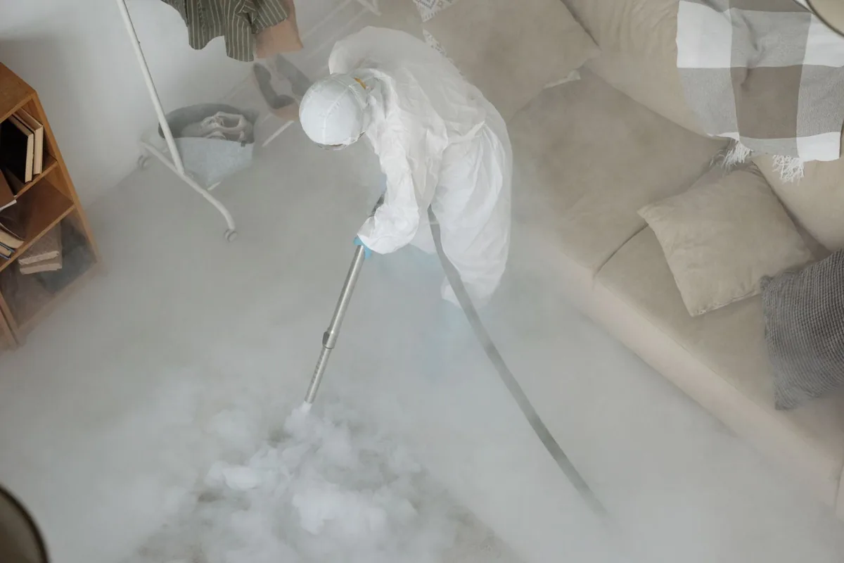 Biohazard cleanup technician in protective equipment, Blairs, VA
